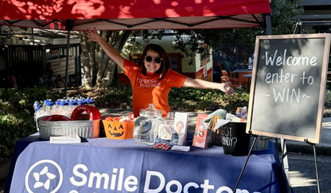 An image of a Awbrey Orthodontics Team Member at a vendors table at a Community Event